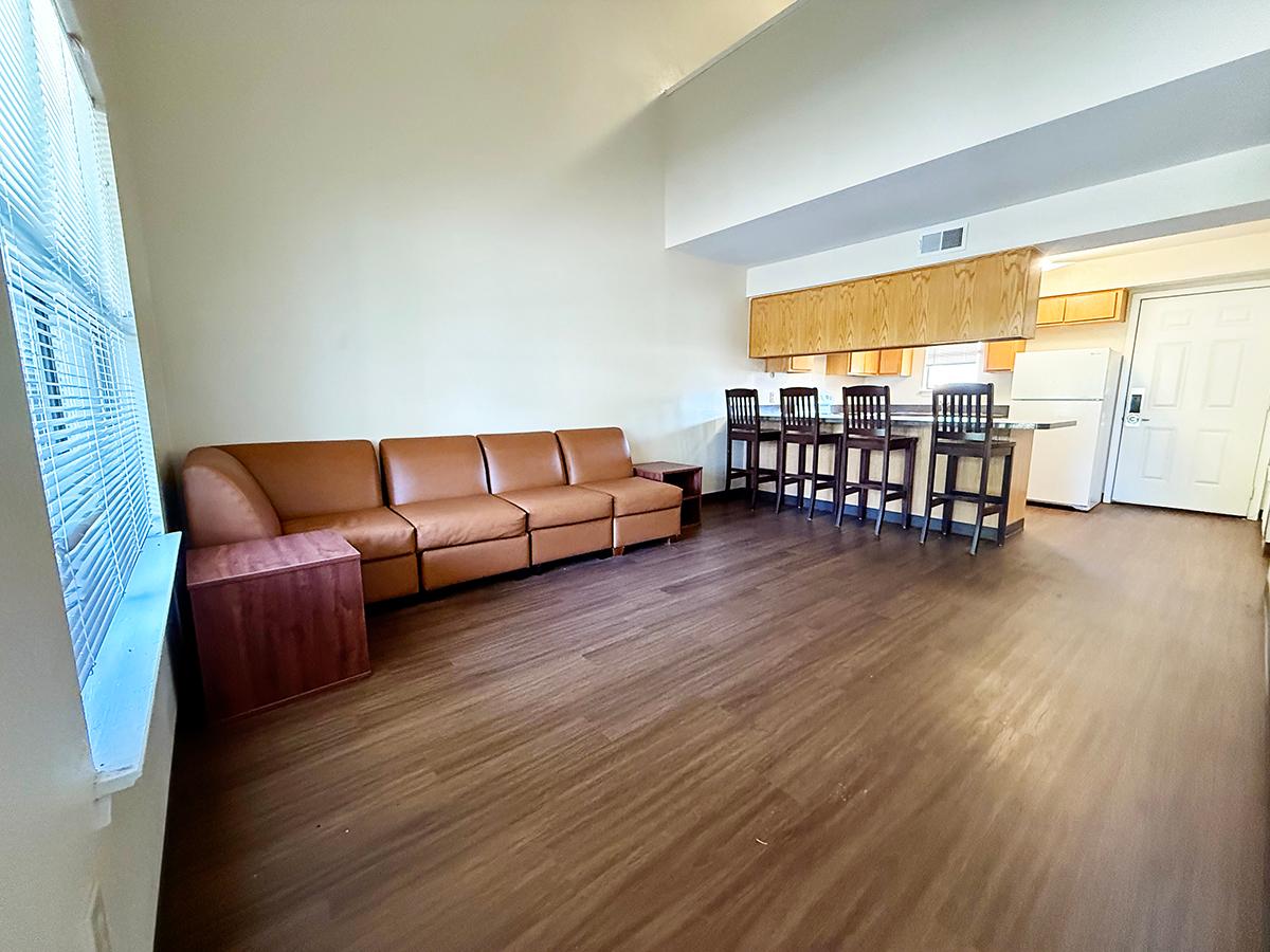 In the living room a sectional sofa and two end tables are provided. Each apartment is completely furnished and air conditioned.